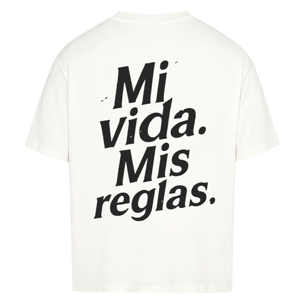 White oversized t-shirt with “Mi vida. Mis reglas.” typography print, back view