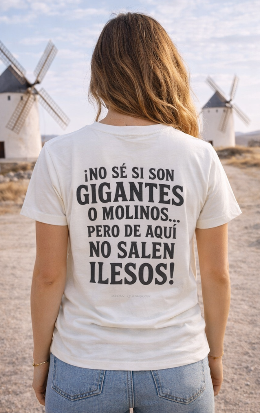 Back view of model wearing cream crew neck T-shirt with Spanish quote print